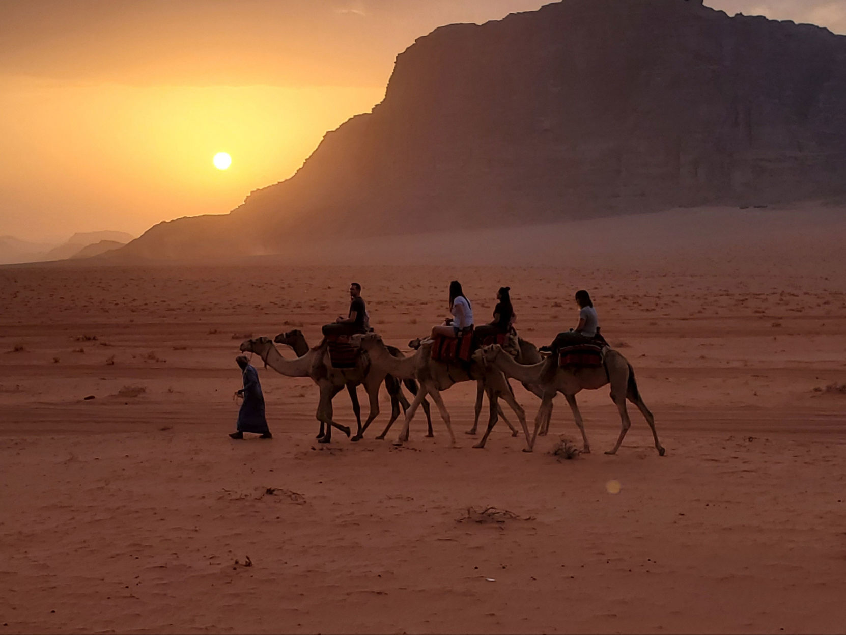 Sunset camel ride in Wadi Rum, Jordan